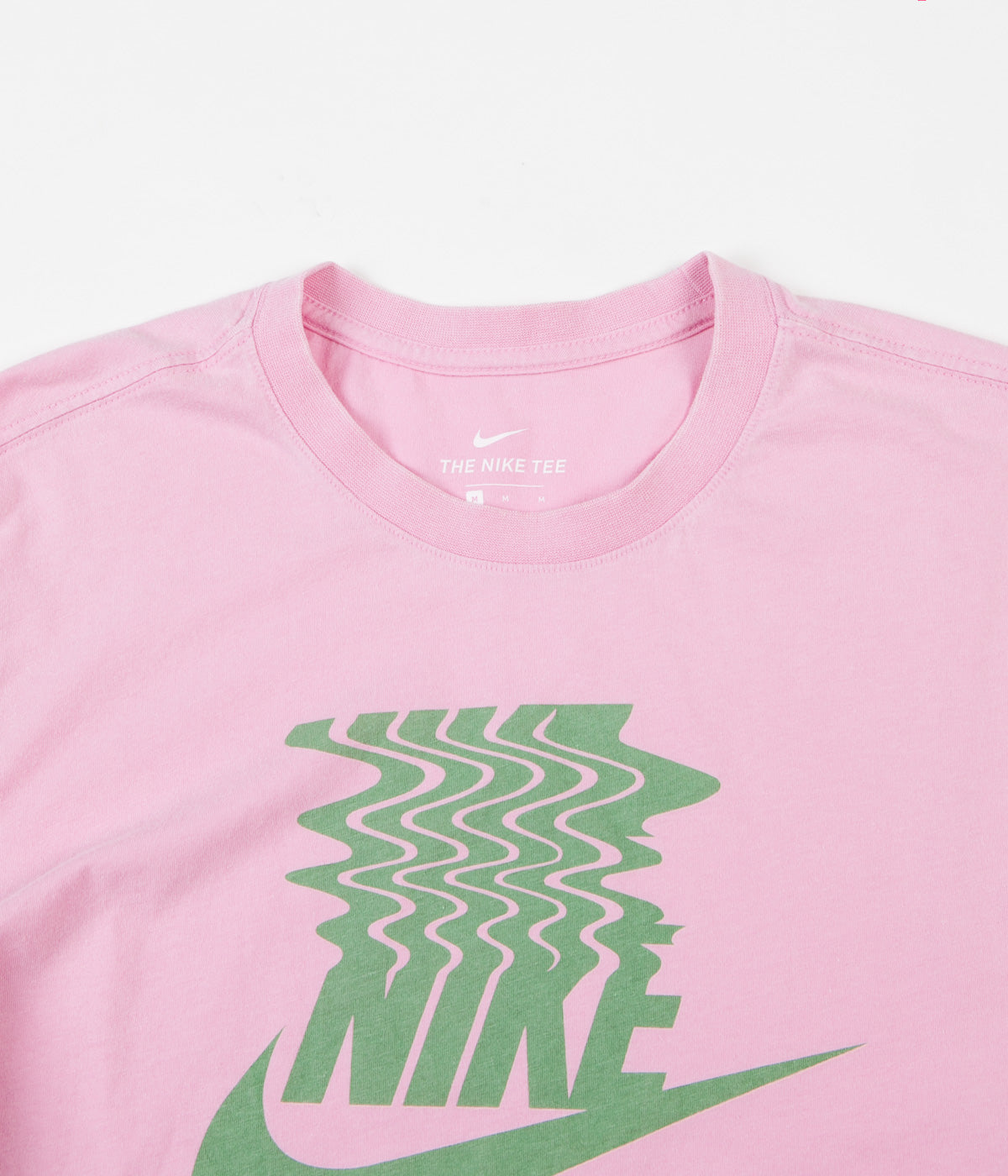 green and pink nike shirt