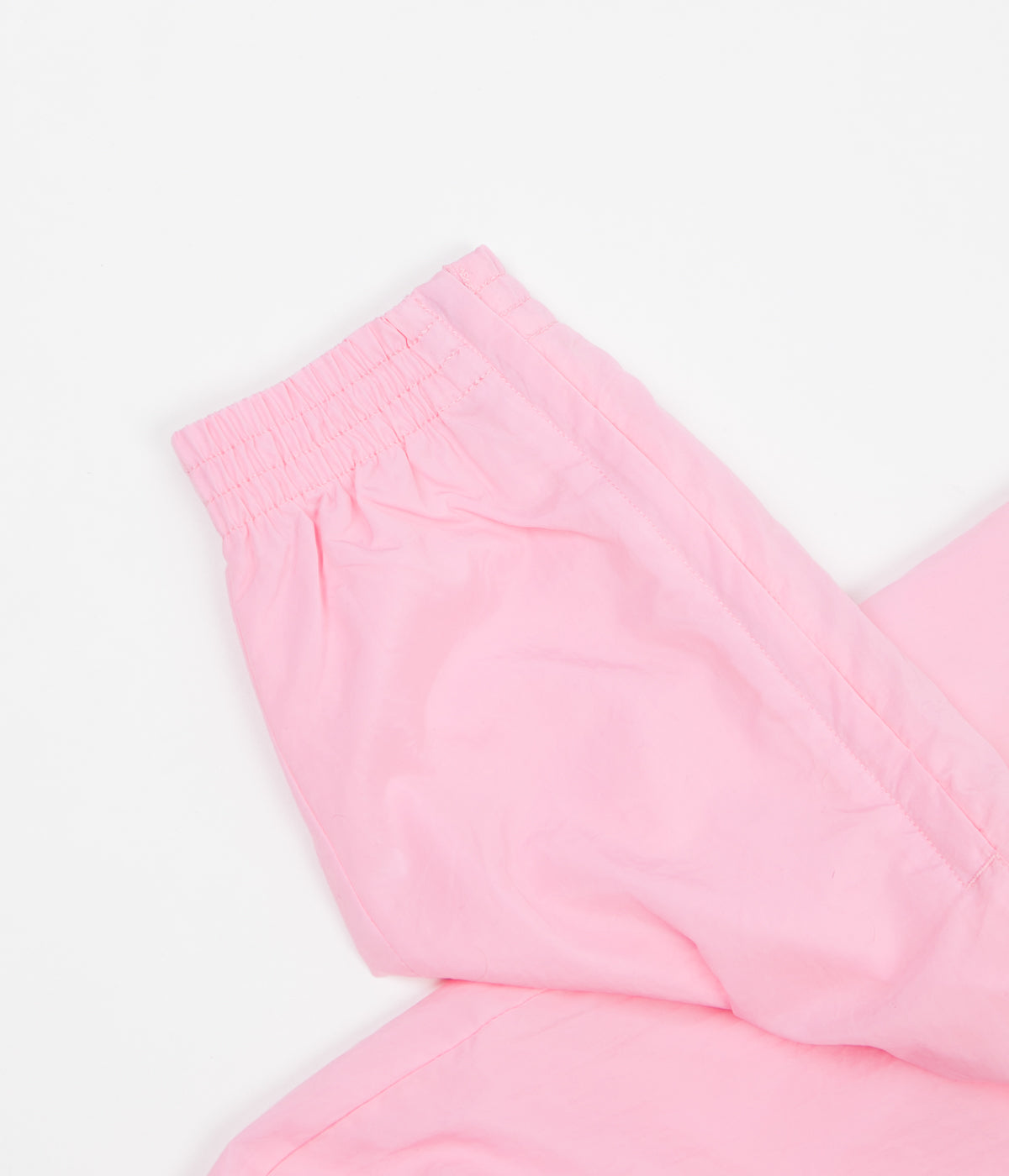 nike swoosh woven pants pink