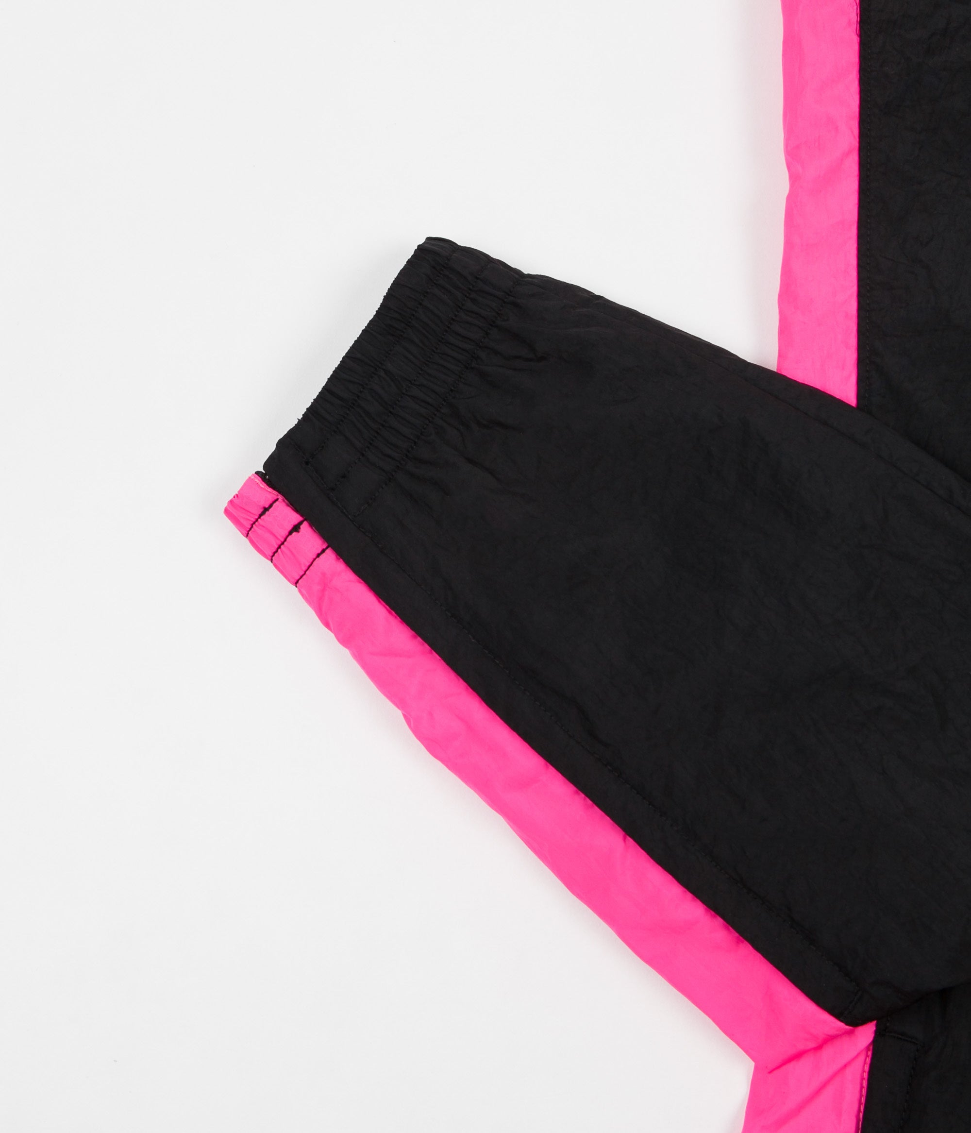 black and pink nike pants