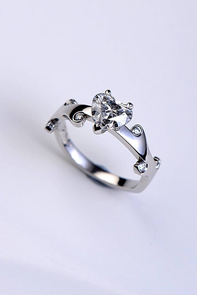 designer heart cut diamond ring with small flame shaped diamond accents