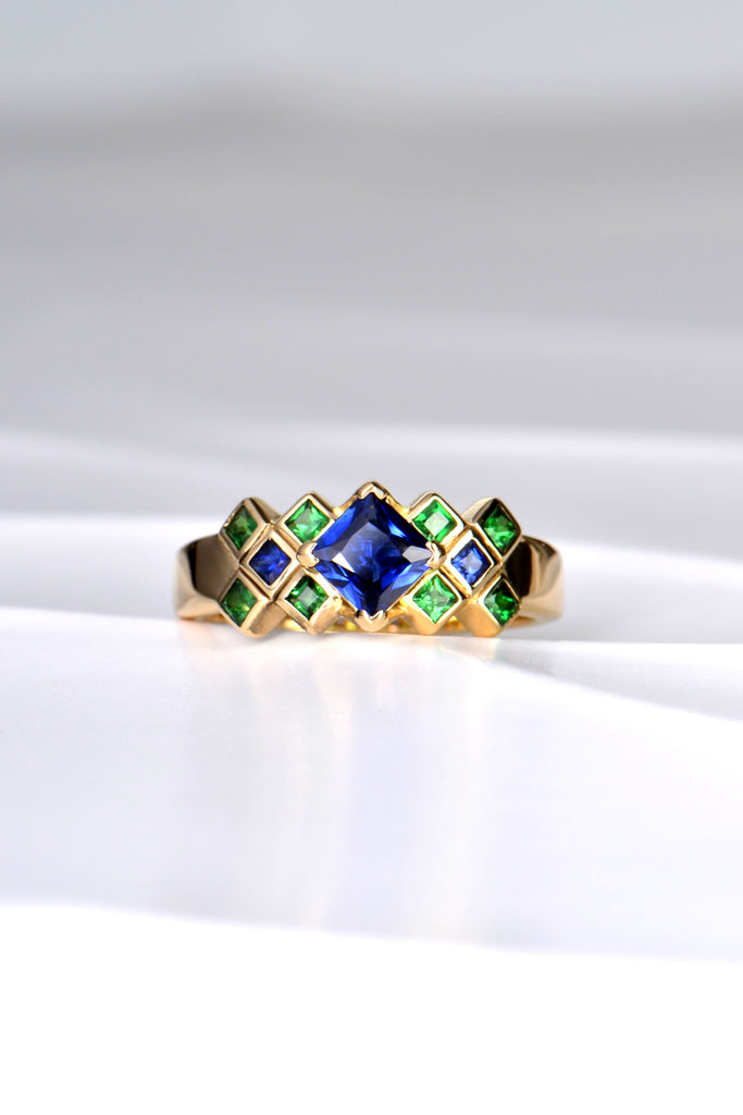 sapphire and green garnet designer ring in a tartan shaped layout