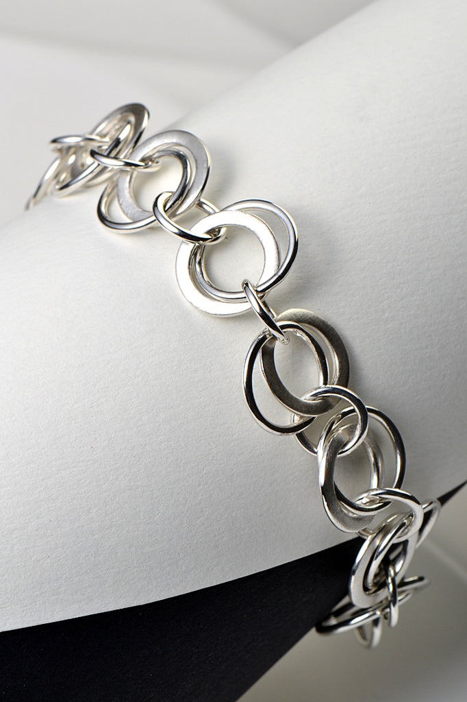 sterling silver designer circle handmade bracelet that can be adjusted in size to fit