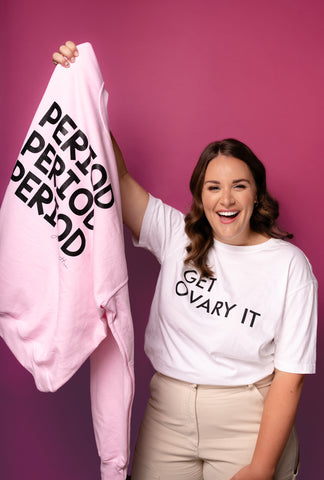 Rachel holding up the period sweater