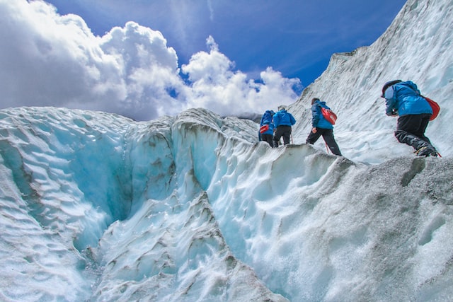 persons doing ice climbing