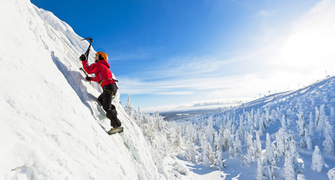 man ice climbing