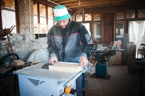 man making a snowboard table