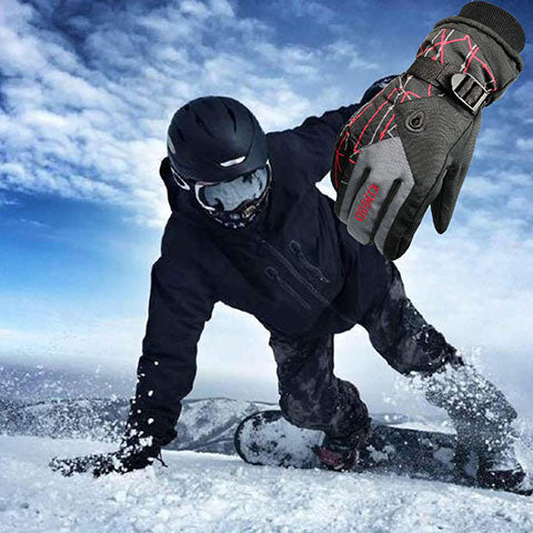 man snowboarding with ski gloves