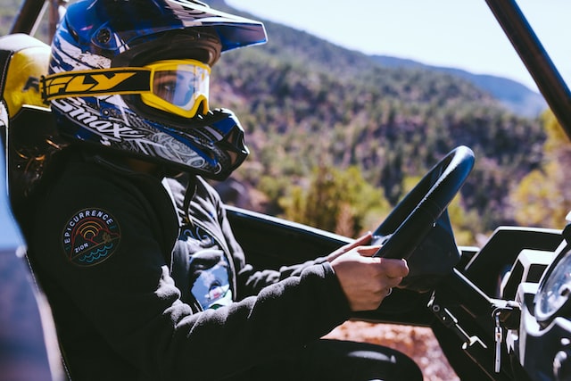 person on snowmobile with helmet