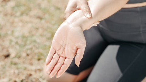 woman stretching her wrist