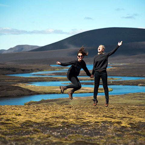 women jumping in their thermals