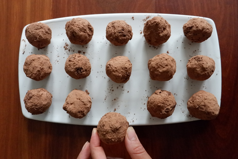 Chai Truffles with fingers getting one piece