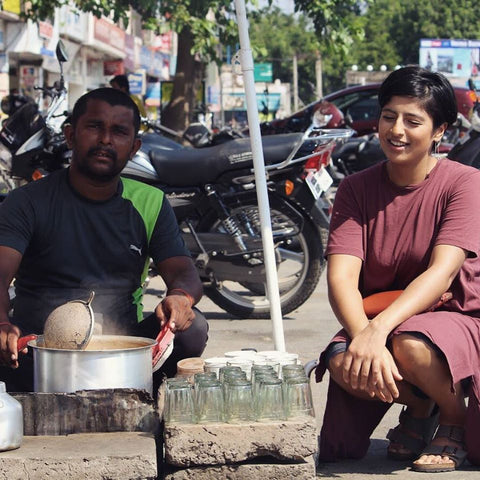 woman and man sitting at a tea stand in India
