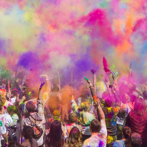 Coloured powders thrown into the air for Holi Festival in India