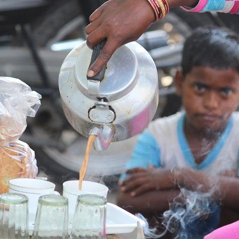 Authentic masala chai being served by a chai wallah in india