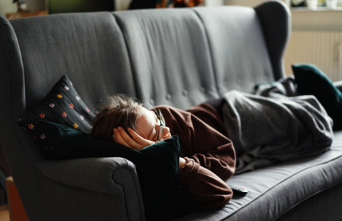 a person working at home, taking a nap