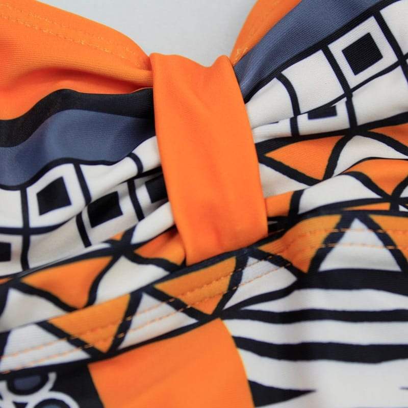 a close up of an orange and blue striped tie