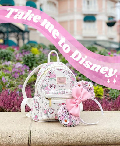 minnie mouse ears and backpack ready for disney at disneyland paris