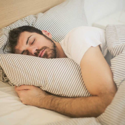 man sleeping having wet dreams