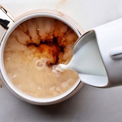 pouring milk into tea