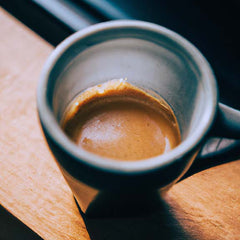 Artisan coffee cup with espresso shot and espresso crème