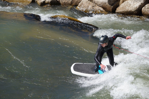 River surfing on the Uncompahgre River in Montrose Colorado.