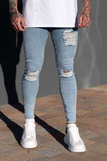 spray on skinny ripped jeans
