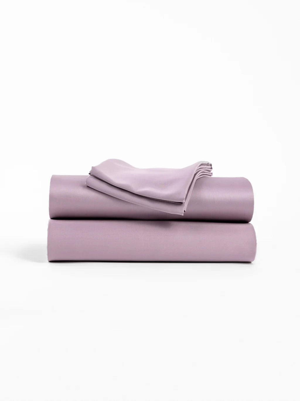 Folded lilac bedding set on a white background.