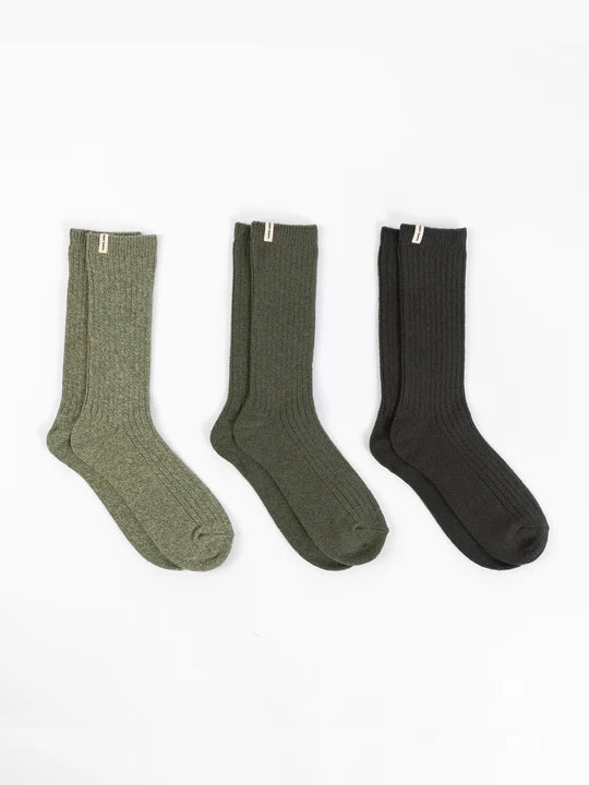 Three pairs of green ribbed socks in varying shades.