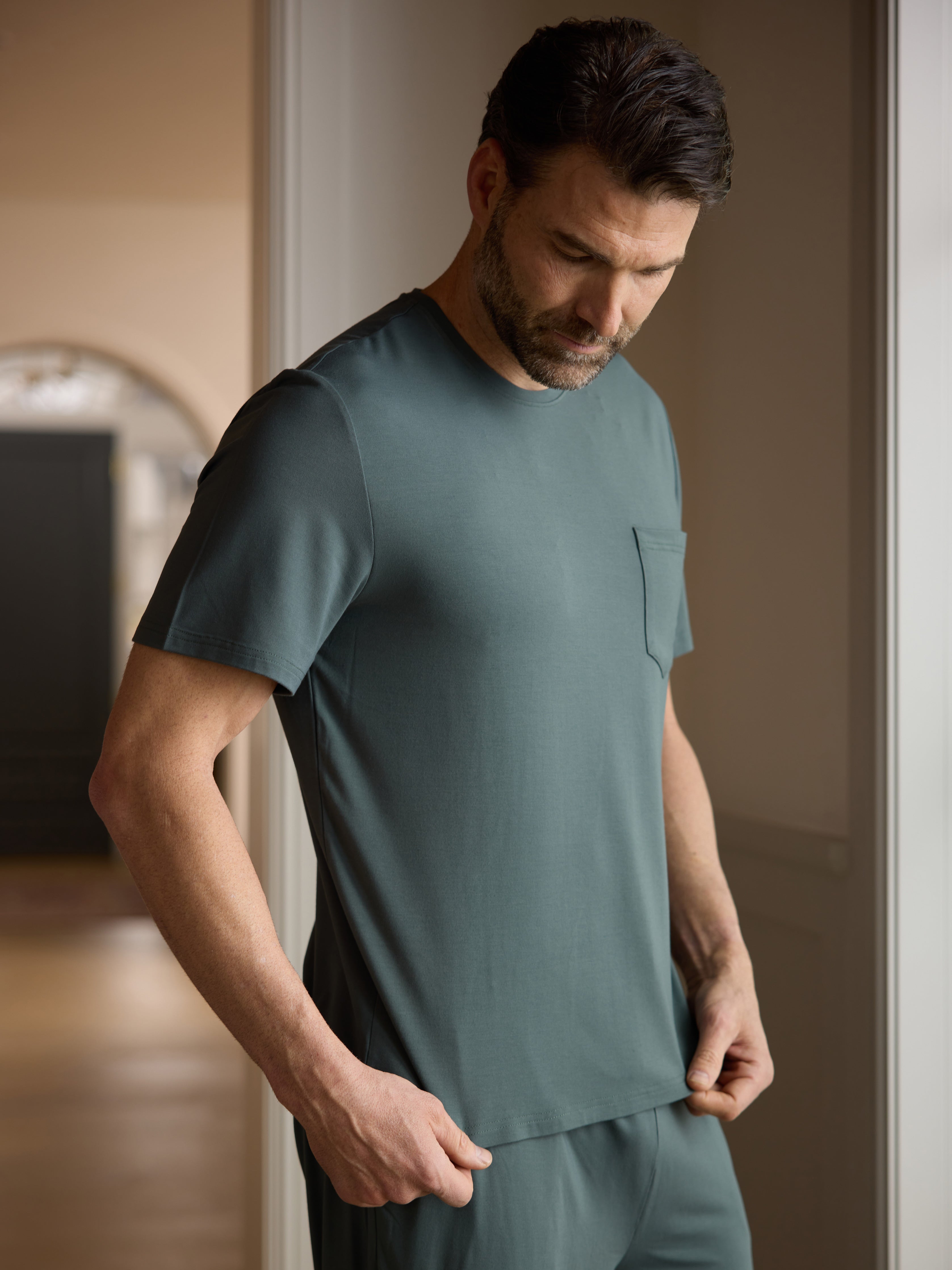 Man wearing storm pajama shirt in hallway |Color:Storm