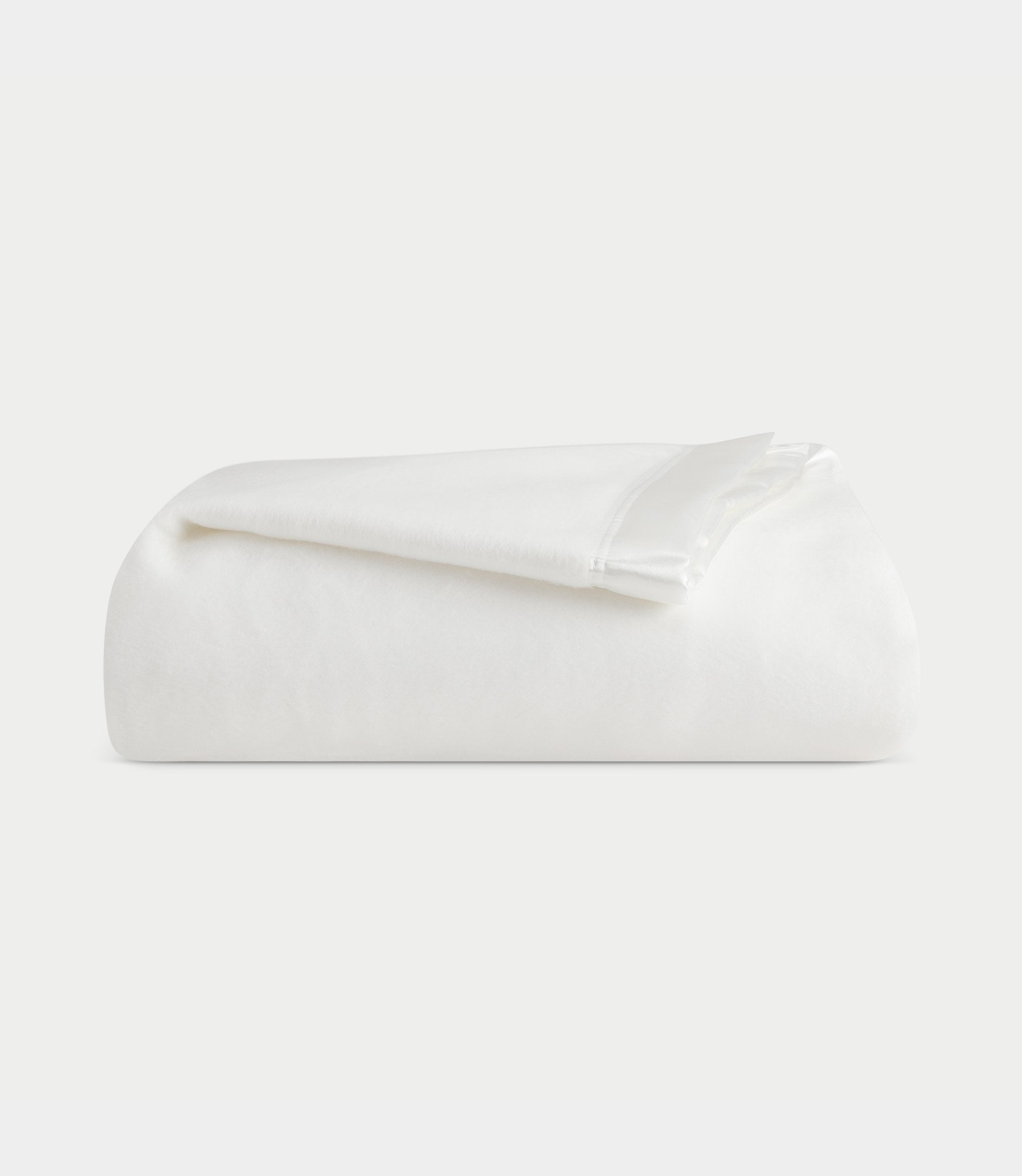 Folded bamboo blanket with white background