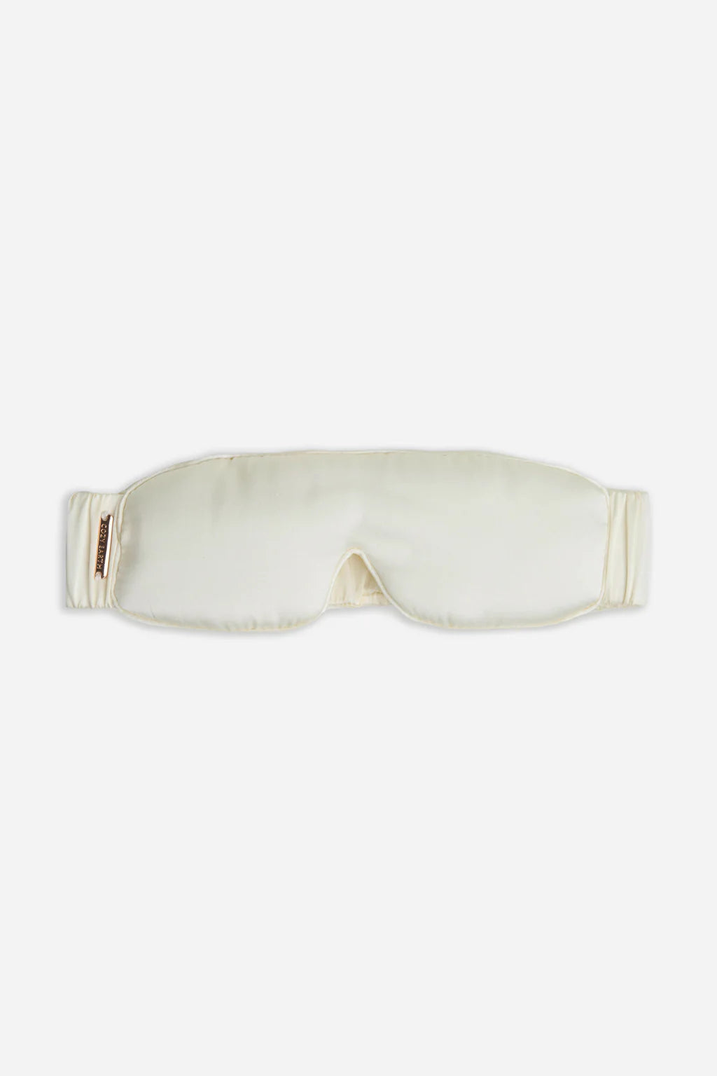 Cream-colored silk sleep mask on a white background.