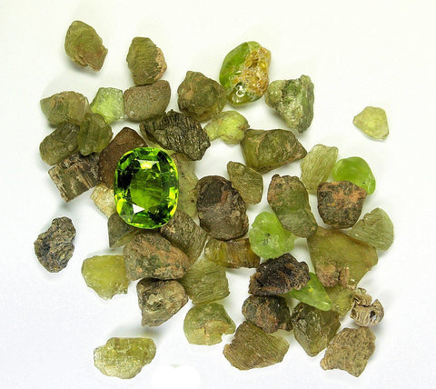 Peridot in rough form and a cut and polished gem