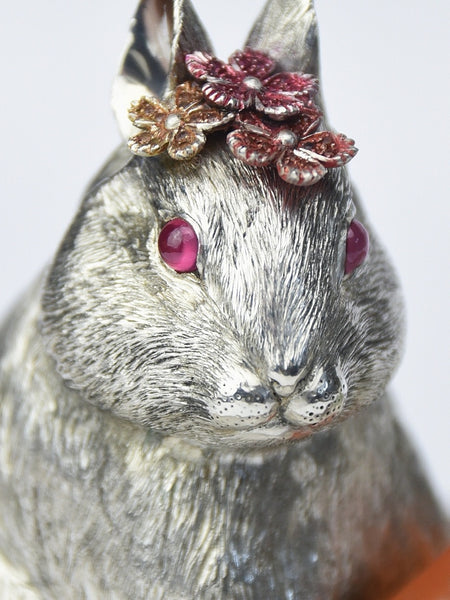 Close up of silver rabbit sculpture with hand-textured details