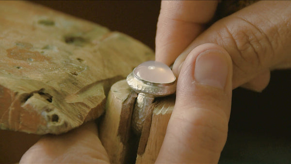 Setting a cabochon rose quartz into the silver ring