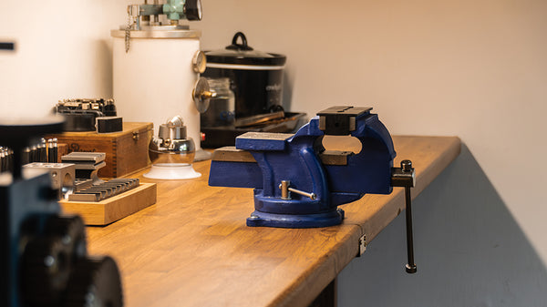 Interior of the TVRRINI jewellery atelier, focusing on a bench vice.
