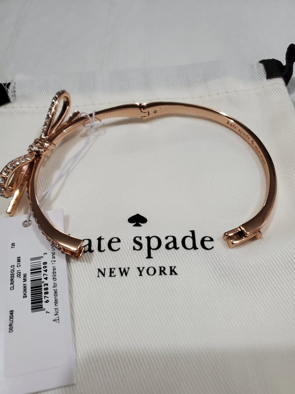Pulsera Kate Spade Skinny Mini Pave Bow Bangle – illa Elite Fashion  Suppliers