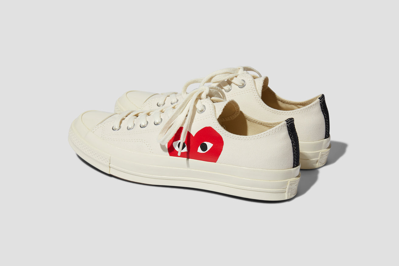 beige converse with red heart