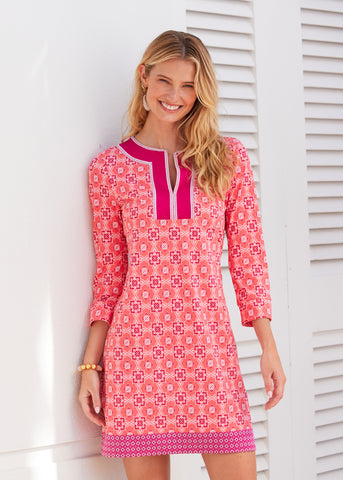 Woman wearing Coral Gables Embroidered Tunic Dress in front of white doors