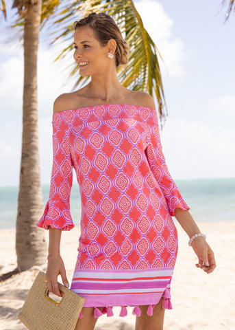 Woman wearing the Coral Geo Off The Shoulder Dress.