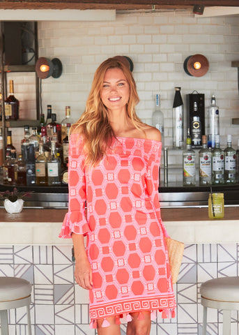 Woman wearing Spring Regatta Off The Shoulder Dress at bar