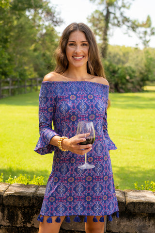 Woman wearing Seattle Off The Shoulder Dress holding wine glass