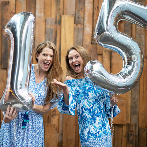 Woman wearing Palm Desert swtorgilde Dresses with 1 & 5 silver balloons