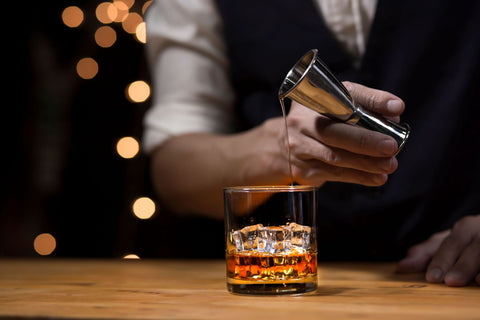 How should whisky be served