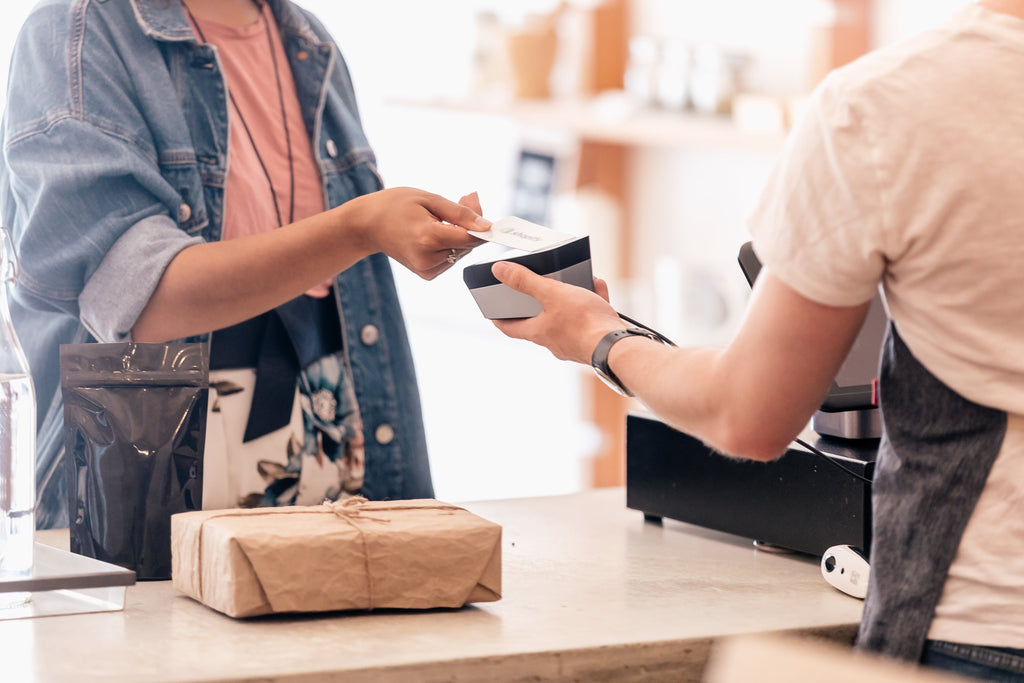 person paying in store credit card shopify pos