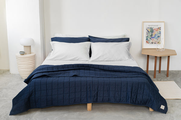 navy-organic-cotton-quilt-with-organic-cotton-classic-cloud-sheet-set-paired-with-classic-navy-pillowcases-by-SOJAO