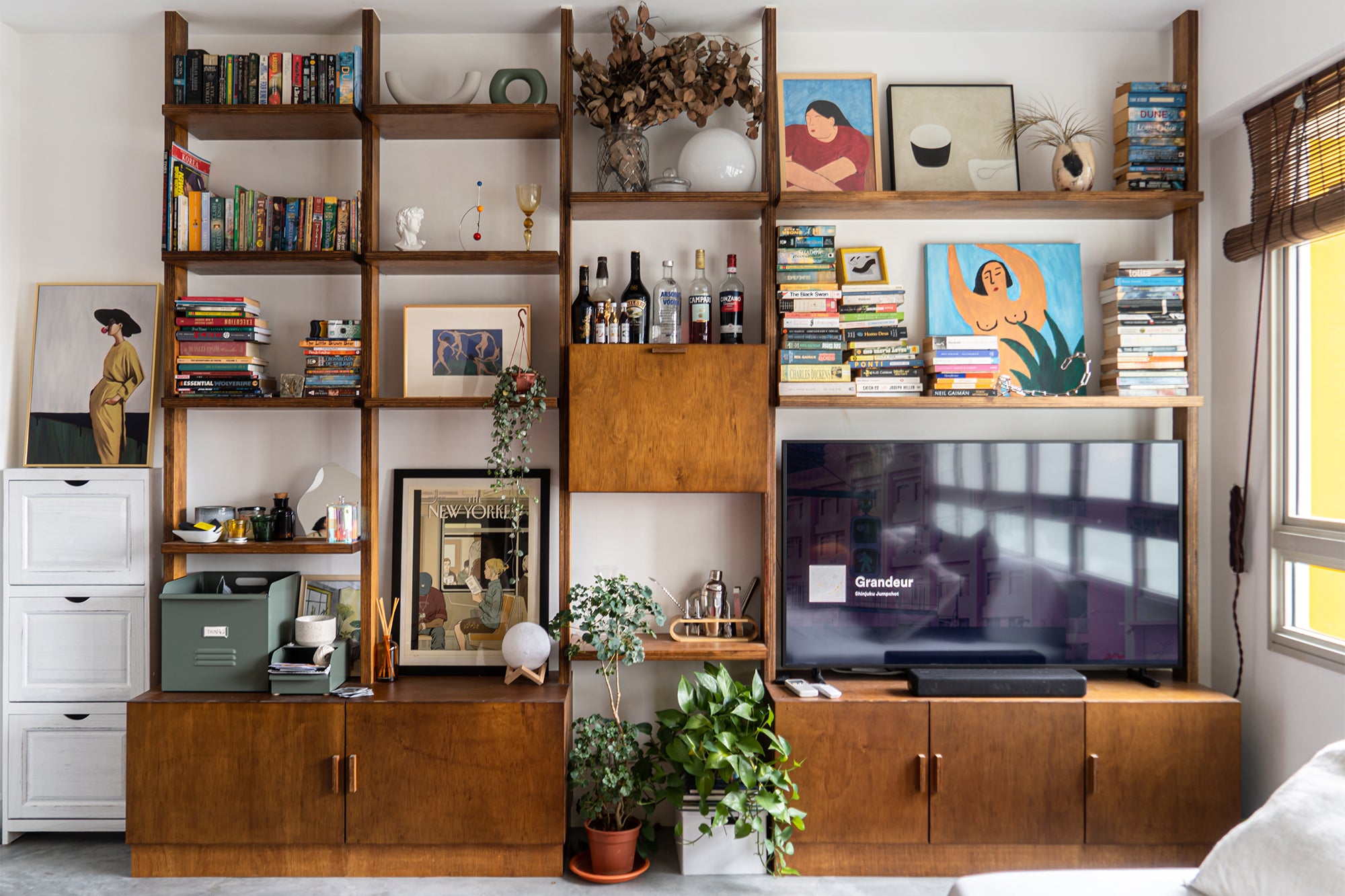 custom made wooden display shelf in art-filled home