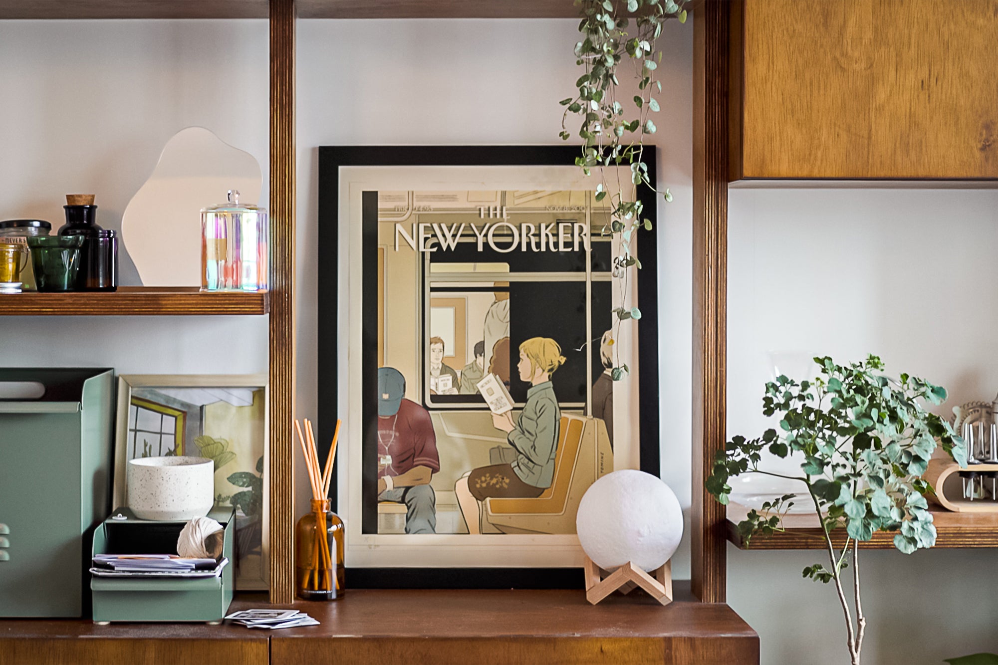 the new yorker magazine framed on wooden shelf