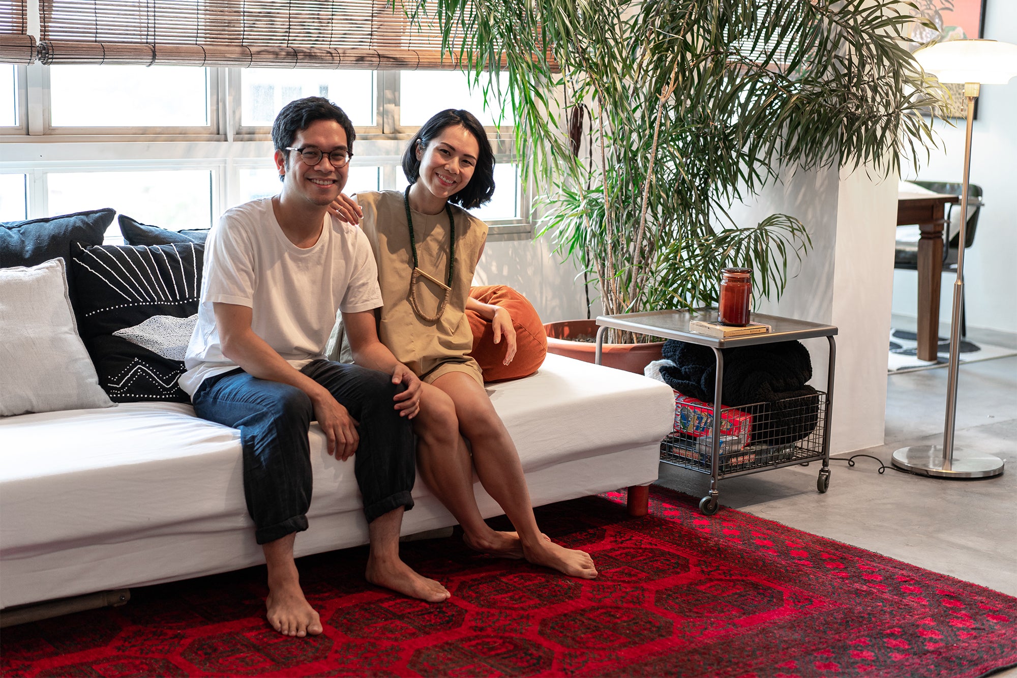 couple in midcentury modern home in singapore