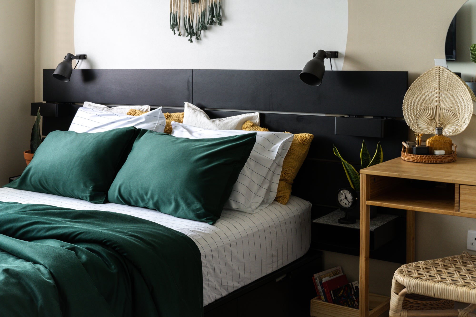 boho modern home with green and striped bedsheets