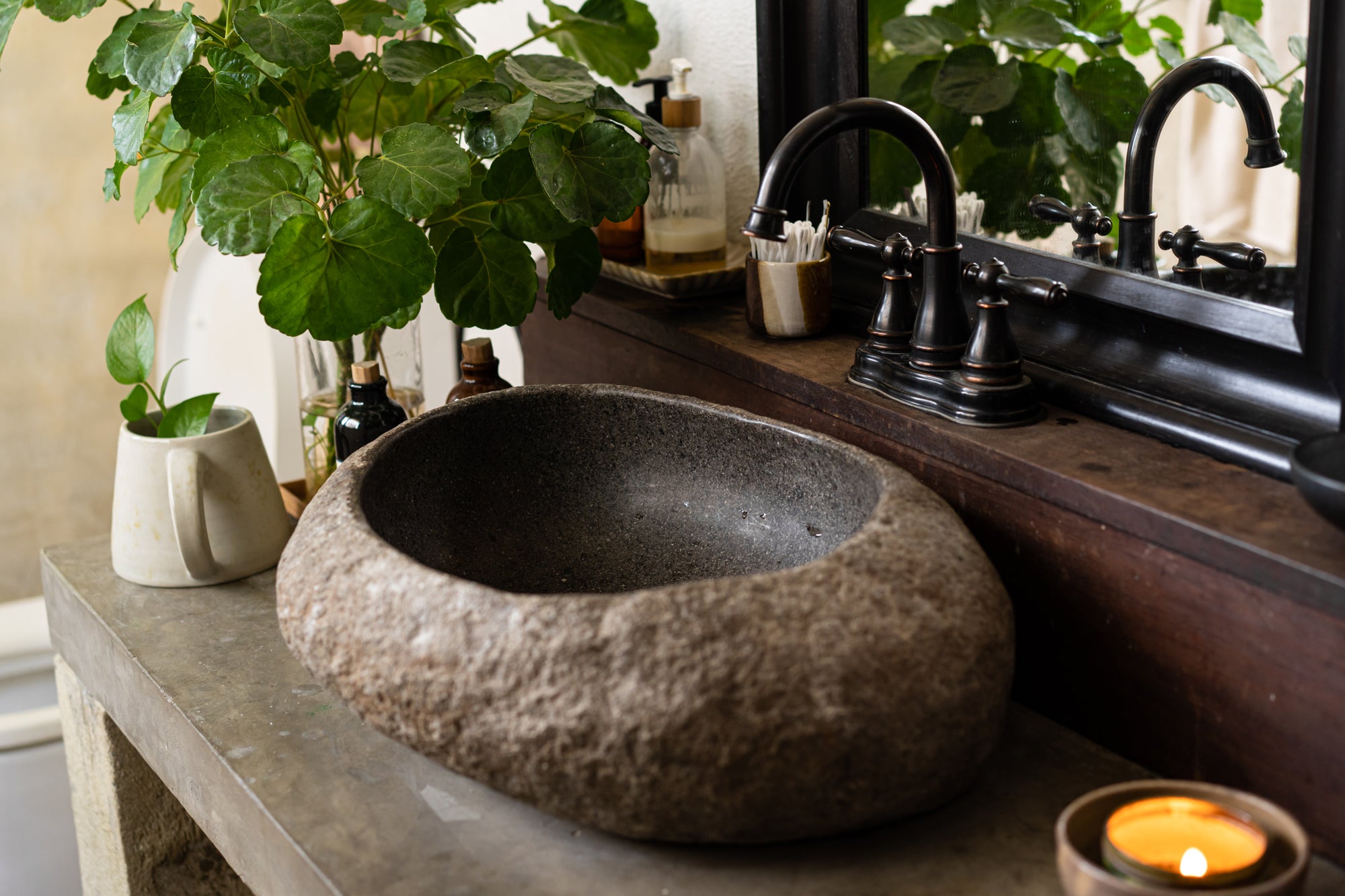unique stone basin with black tap